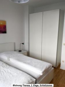 Кровать или кровати в номере Ferienwohnung im Herzen der Koblenzer Altstadt