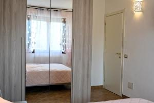 מיטה או מיטות בחדר ב-LA PIGNA mare, collina, Ravenna, Mirabilandia, Cottignola