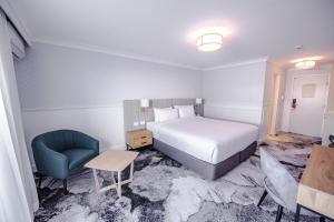 Postel nebo postele na pokoji v ubytování Comfort Inn Towradgi Beach
