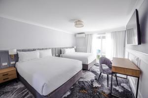 Postel nebo postele na pokoji v ubytování Comfort Inn Towradgi Beach