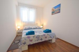 Postel nebo postele na pokoji v ubytování Apartment Gem