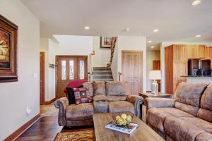 a living room with two couches and a table at Highland Greens 93 Apartment in Breckenridge