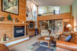 a living room with a couch and a fireplace at Ski Hill 32 in Breckenridge