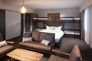 Postel nebo postele na pokoji v ubytování ALPHABED INN 小樽駅前