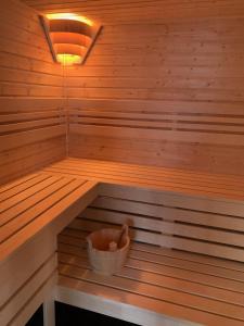 a sauna with a bucket in the middle of it at Ubytovanie MI - TATRY in Kravany