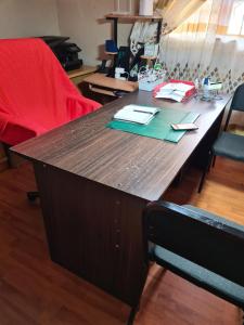 a large wooden table in a room at Baraka House in Midrand +1 photo