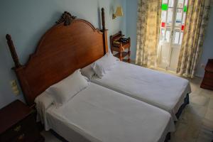 Postel nebo postele na pokoji v ubytování Hotel Playa de Regla