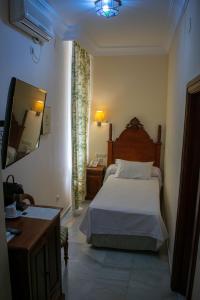 Postel nebo postele na pokoji v ubytování Hotel Playa de Regla