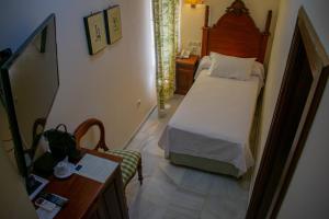 Postel nebo postele na pokoji v ubytování Hotel Playa de Regla