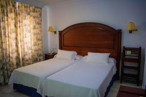 Postel nebo postele na pokoji v ubytování Hotel Playa de Regla