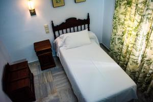 Postel nebo postele na pokoji v ubytování Hotel Playa de Regla