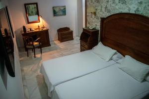 Postel nebo postele na pokoji v ubytování Hotel Playa de Regla