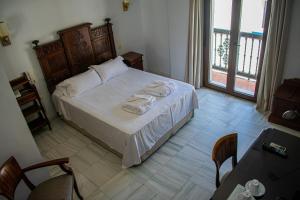 Postel nebo postele na pokoji v ubytování Hotel Playa de Regla
