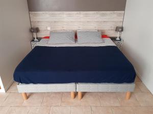 Postel nebo postele na pokoji v ubytování Le Gîte des Marguerites