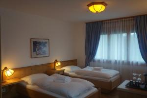 Voodi või voodid majutusasutuse Hotel Sternen toas +18 fotot