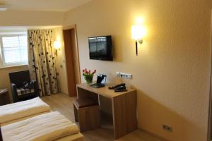 TV a/nebo společenská místnost v ubytování Hotel Grasberger Hof GmbH