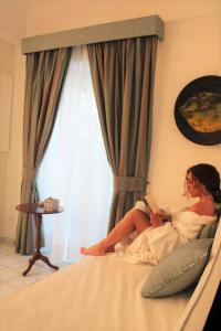 A bed or beds in a room at Villa Gelsomina