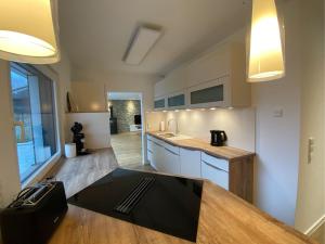 a kitchen with a table and a counter top at Ferienwohnung Bauer in Eppingen