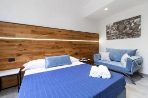 מיטה או מיטות בחדר ב-Hotel Portum