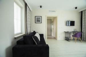 Televízia a/alebo spoločenská miestnosť v ubytovaní Publo Spa Hotel