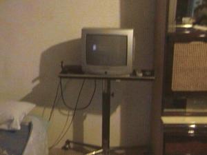 a computer monitor sitting on a table in a room at Appartement Soleyade in Vedène