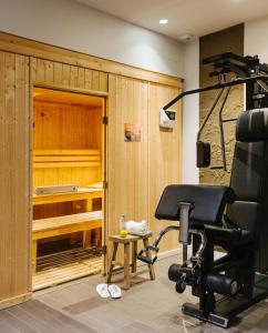 a gym with a chair in a room at Le Parisis - Paris Tour Eiffel in Paris