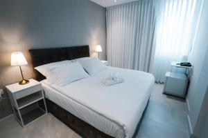 Unique Hotel Ashdod客房内的一张或多张床位
