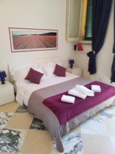A bed or beds in a room at Michelangelo al Duomo - Bufalini Apartments