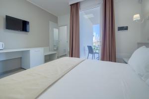 Postel nebo postele na pokoji v ubytování Smart Hotel Ugento