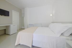 Postel nebo postele na pokoji v ubytování Smart Hotel Ugento