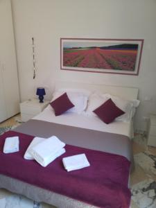 A bed or beds in a room at Michelangelo al Duomo - Bufalini Apartments