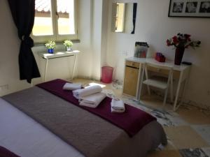 A bed or beds in a room at Michelangelo al Duomo - Bufalini Apartments