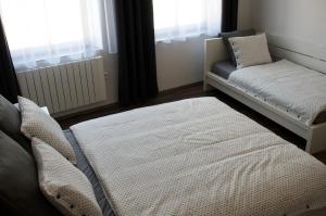 Postel nebo postele na pokoji v ubytování R&J apartmány