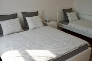 Postel nebo postele na pokoji v ubytování R&J apartmány