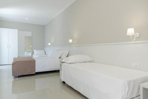 Postel nebo postele na pokoji v ubytování Smart Hotel Ugento