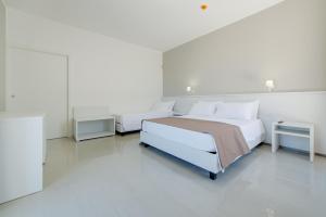 Postel nebo postele na pokoji v ubytování Smart Hotel Ugento