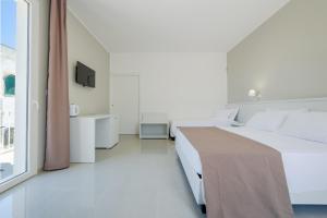 Postel nebo postele na pokoji v ubytování Smart Hotel Ugento