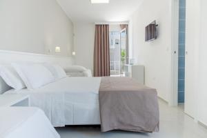 Postel nebo postele na pokoji v ubytování Smart Hotel Ugento