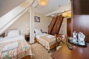 Posteľ alebo postele v izbe v ubytovaní Hotel Mona Lisa Wellness & Spa + 37 fotografií