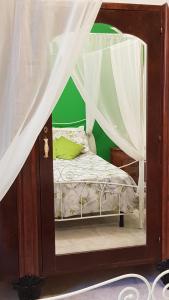 a small bedroom with a bed with a canopy at Amanda's Dream in Taranto