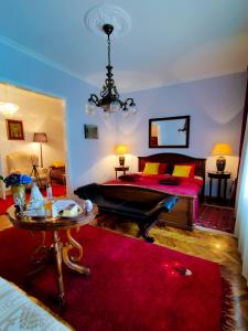 a bedroom with a bed and a red rug at 2 on seven in Zagreb