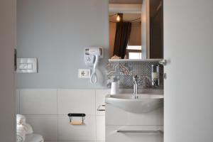 Koupelna v ubytování Al Faro Bianco B&B e Residence con parcheggio