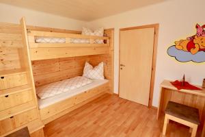 Postel nebo postele na pokoji v ubytování Zechmann-Tauernblick + 4 fotografie