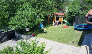 an aerial view of a backyard with a playground at Royal Villas in Bryastovets