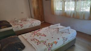 Postel nebo postele na pokoji v ubytování Teo Hotel&Pansion