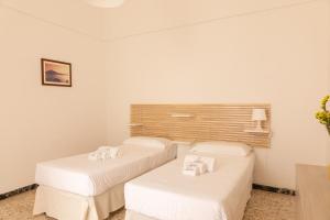 En eller flere senge i et værelse på Casa Labbate