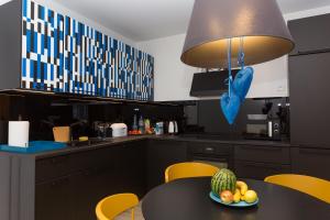 Kuchyňa alebo kuchynka v ubytovaní Apartament Kołobrzeg Quattro