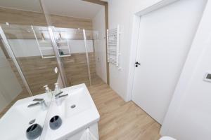 Kúpeľňa v ubytovaní Apartament Kołobrzeg Quattro
