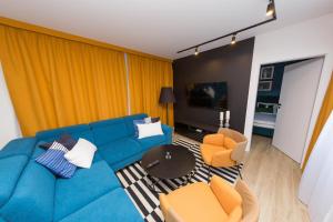 Televízia a/alebo spoločenská miestnosť v ubytovaní Apartament Kołobrzeg Quattro