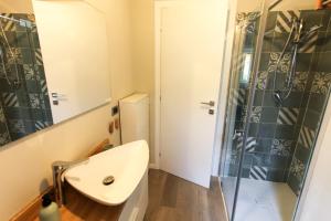 a bathroom with a sink and a shower at Maison Olive in Desenzano del Garda +18 photos